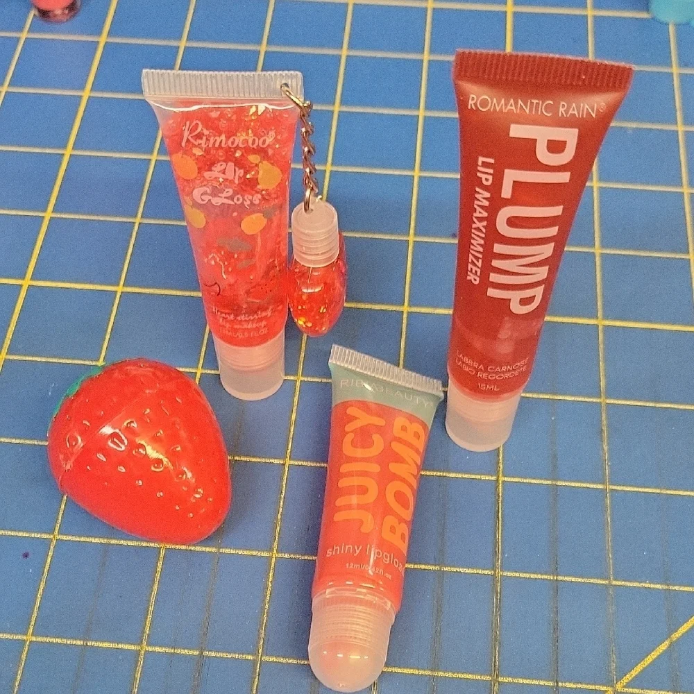 Lot of 4  Lip Gloss & Plumper New